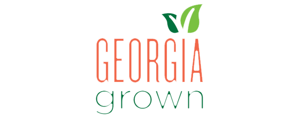 Georgia Grown logo featuring bold orange and green typography with leaf accents, representing the state's agricultural products and commitment to local farming.